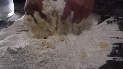 chef-kneading-preparation-with-flour-and-water