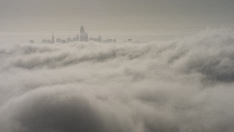 The-skyline-of-a-city-beyond-a-sea-of-clouds
