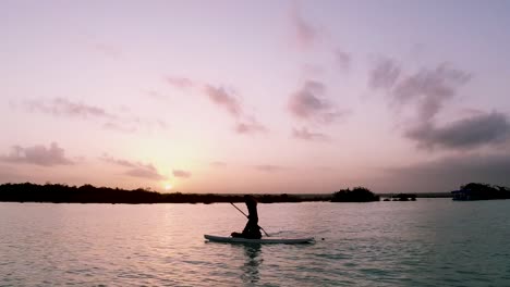 SUP-boarders-coming-off-their-boards-during-a-sunrise-tour-on-Lake-Bacalar-in-Mexico