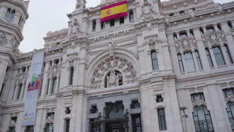 Exterior-Facade-Of-The-Post-Office-Building-In-Plaza-Cibeles,-Madrid,-Spain---tilt-up-shot