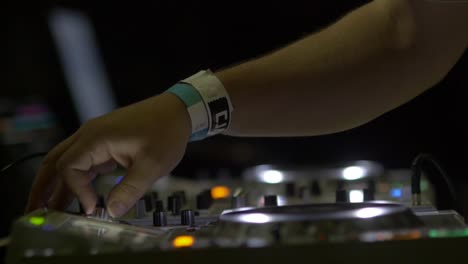 DJs-Hand-Turning-Knobs-On-DJ-Deck