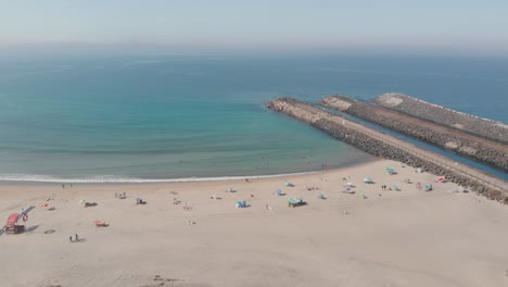 Drone-flies-forward-into-an-aerial-view-of-the-beach-of-SÃ£o-Torpes