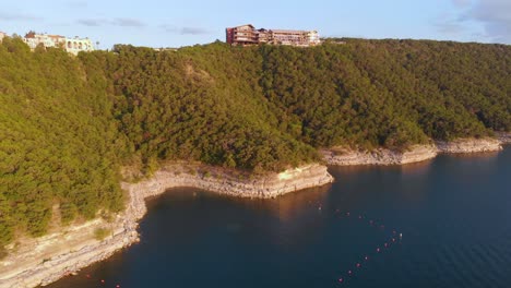 Aerial-shot-of-a-swimming-hole-right-under-the-oasis-on-lake-travis-in-Austin-Texas