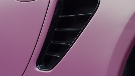 Intake-engine-cooling-vents-of-pink-coated-Porsche-Boxster-cabriolet
