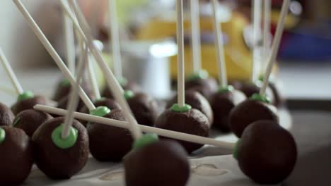 Close-up-slow-motion-of-pile-of-chocolate-cake-pops,-homemade-pastry