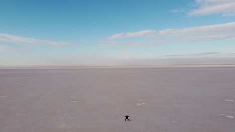Girl-in-a-peaceful-moment-of-yoga-flow-in-the-midle-of-a-Salt-flat-in-Turkey