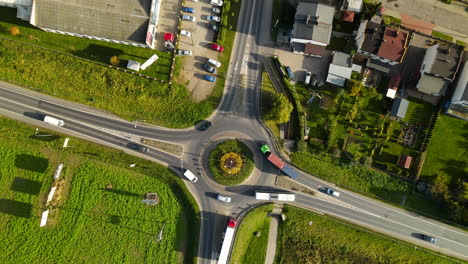 Vehicles-Driving-At-Roundabout-On-A-Sunny-Day-In-Lubawa,-Poland