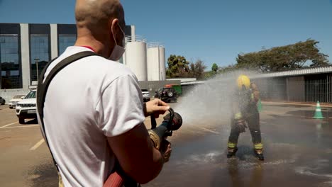 Firefighter-decontaminates-from-virus-and-chemicals-after-responding-to-a-fire-at-the-Santa-Luzia-COVID-19-Hospital
