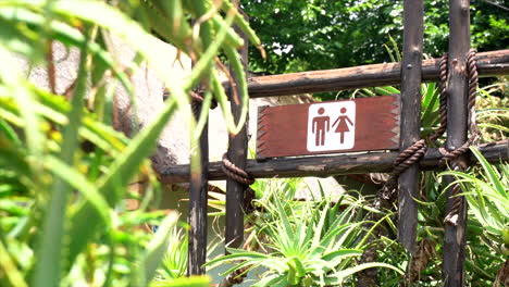 Male-and-Female-restroom-signage,-slow-panning-shot-left-to-right