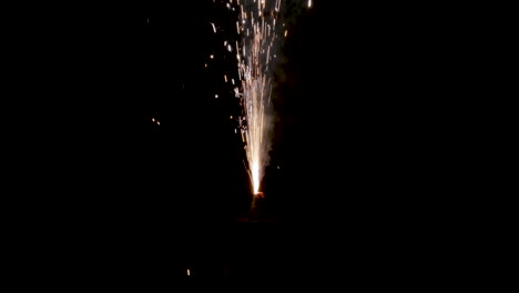 Sparks-flying-from-sparkler-firework-in-darkness