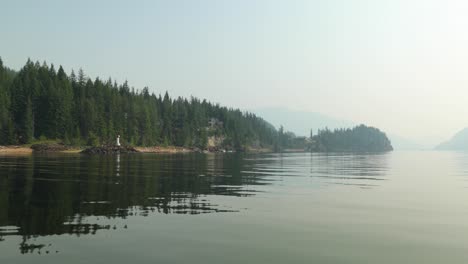 Boating-on-the-Shushwap-passing-by-the-lake-shore