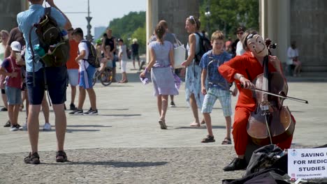 Street-Performer-Playing-Cello-for-Tourists-at-Brandenburg-Gate-in-Berlin