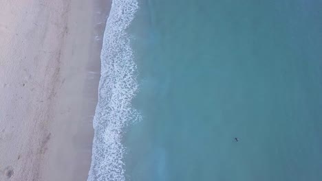 Beautiful-Blue-Ocean---Sea-Waves-Crashing-On-Beach-In-Newquay-United-Kingdom---aerial-shot