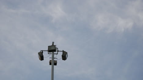 Clouds-In-The-Sky-Flying-Above-Light-Post-Outdoor---low-angle,-time-lapse