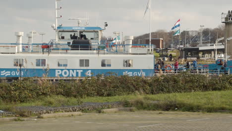 Wide-shot-of-people-boarding-Amsterdam-ferry-boat