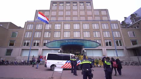 Police-Visibility-In-Front-Of-Royal-Dutch-Shell-Headquarters-Building-In-The-Hague,-Netherlands-During-XR-Activists-Protest---climate-change,-shell-hq