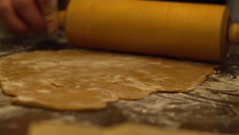 Flattening-gingerbread-dough-with-rolling-pin