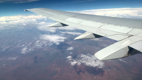 Wide-shot-of-the-wing-of-a-large-aeroplane-in-flight
