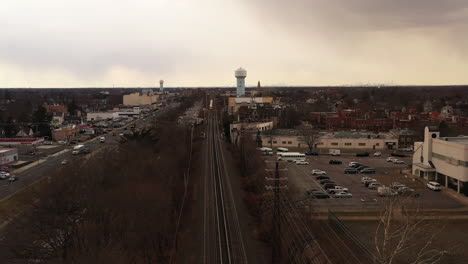 An-aerial-view-over-railroad-tracks-on-a-cloudy-day
