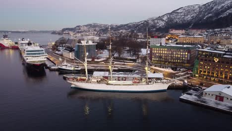 Aerial-flying-backwards-Norwegian-sailing-ship-Statsraad-Lehmkuhl-at-Bergen-harbour---Winter-season