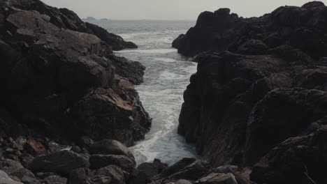 Stationary-Shot-of-Waves-Crashing-through-Large-Rocks-in-Ucluelet-BC