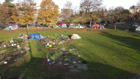Homeless-people-and-their-ramshackle-tents-line-the-north-end-of-Cal-Anderson-Park,-aerial