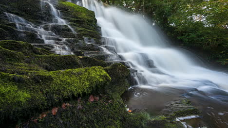 Time-lapse-of-forest-waterfall-in-rural-landscape-during-autumn-in-Ireland