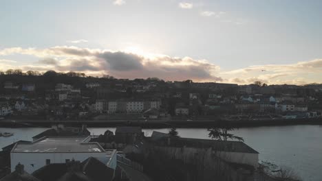Sunset-and-low-light-aerial-over-Kinsale,-coastal-town-in-Ireland-in-winter-of-2021
