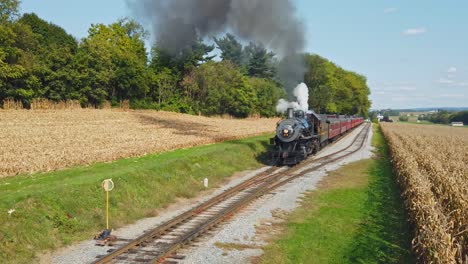 An-Antique-Restored-Locomotive-and-Passenger-Coaches-Approaching-on-a-Sunny-Day-Traveling-Thru-the-Countryside-Viewed-from-an-Elevated-Height
