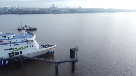 Aerial-view-Mersey-passenger-ferry-passing-Stena-Line-ship-on-city-dock-waterway