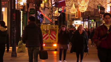 Close-up-still-shot-of-a-Dublin-street-at-Chrismas-time-in-hard-times-with-some-people-on-a-not-so-busy-street-as-local-businesses-have-to-deal-with