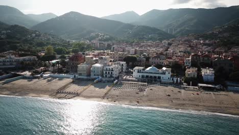 Town,-mountains-and-a-sandy-beach-next-to-the-Mediterranean