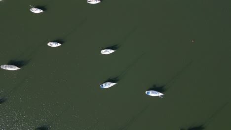 Aerial-top-down-of-boats-reveals-the-ramp,-dock,-and-jetty