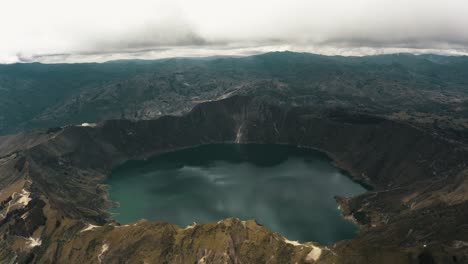 Volcanic-Crater-Lagoon-Of-Quilotoa,-Quito-Region,-Ecuador---aerial-drone-shot
