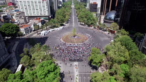 Aerial-Drone-View-Of-Glorieta-De-La-Palma-Roundabout-With-Crowds-To-See-The-New-Ahuehuete-Tree-Guardian-of-Missing-Persons-Mexico-City