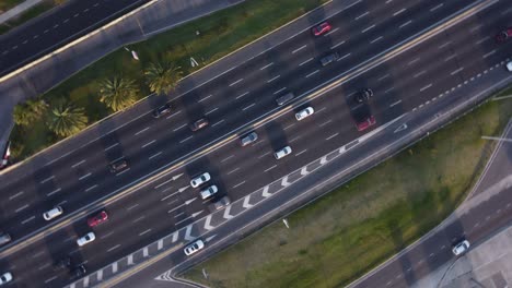Aerial-top-down-shot-of-cars-and-vehicles-driving-on-General-Paz-highway-in-Buenos-Aires-City