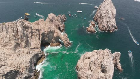 Aerial-View-of-Rock-Formation-and-Arch-in-Ocean