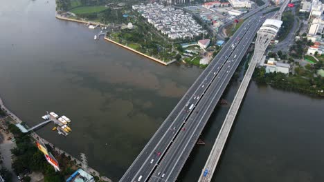 Aerial-view-overlooking-Cau-Sai-Gon-bridge-revealing-skyscrapers-in-the-Phuong-22-district-of-Ho-chi-minh,-Vietnam---tilt,-drone-shot