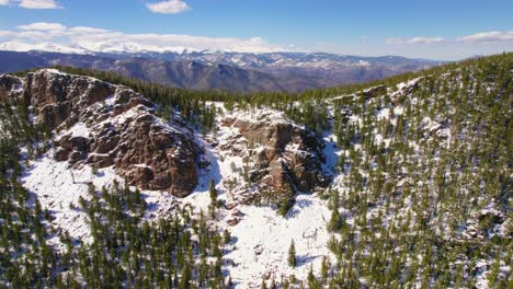 Aerial-Footage-Flying-Over-Snowy-Alpine-Mountain-Ridge-To-Reveal-Beautiful-Wide-Open-Rocky-Mountains-Range-Landscape-In-Mount-Evans-Colorado-USA