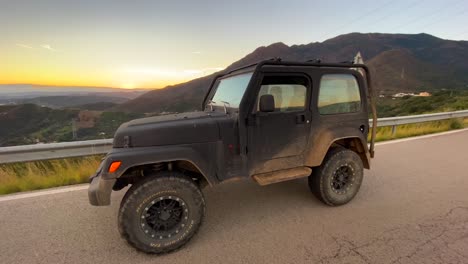 Cool-Jeep-4x4-car-with-beautiful-sunset-on-a-mountain,-fun-ATV-adventures-in-Marbella-Malaga-Spain,-4K-shot