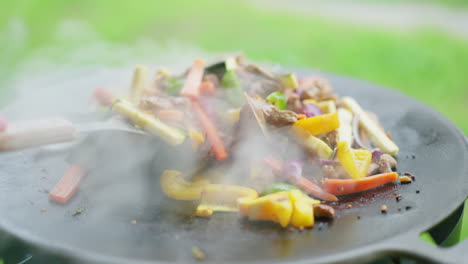 Sauteing-Chopped-Vegetables-And-Meat-In-A-Wok-Pan-Outdoor