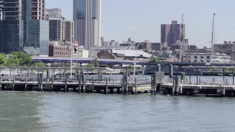 A-static-shot-of-New-York-City-downtown-financial-district-skyline-with-Brooklyn-Bridge-on-East-River