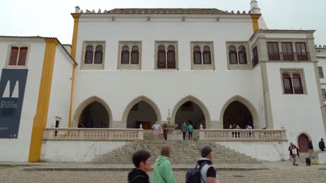 Sintra-National-Palace-on-Cloudy-Day-with-People-Walking-and-Enjoying-Sightseeing
