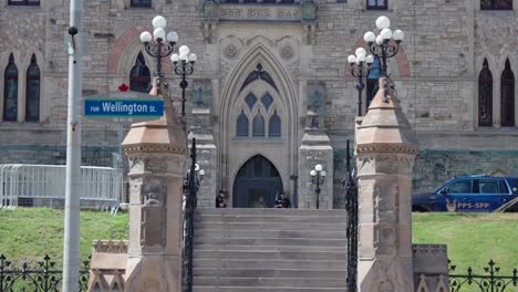 Canadian-police-guarding-the-main-entrance-to-West-Block-on-Parliament-Hill-on-a-sunny-summer-day---4K-slow-motion