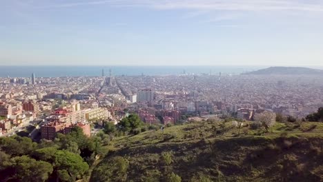 Barcelona-Cityscape-Aerial-Shot-Zooming-Out-Vertigo-Effect-At-Sunset