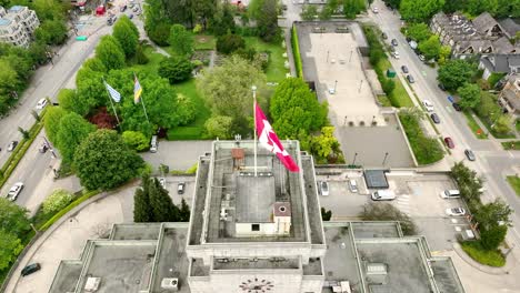 Vancouver-Town-Hall-With-Canadian-Flag-On-Its-Rooftop-At-Daytime-In-Vancouver,-BC,-Canada