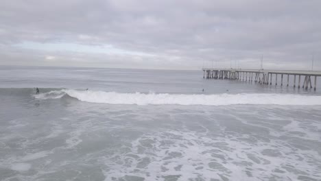 Surfer-catches-a-wave-at-Venice-Pier-in-the-morning