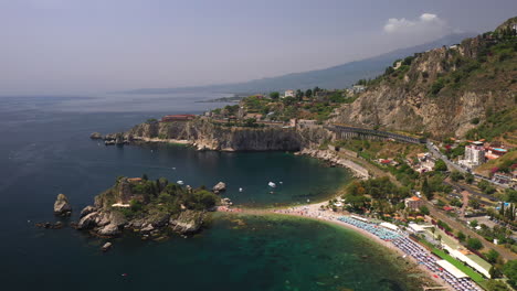 Drone-shot-of-Isola-Bella-a-small-island-near-Taormina,-Sicily,-southern-Italy