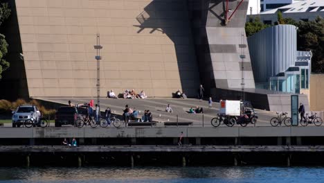 People-walking-and-enjoying-the-capital-waterfront-and-Te-Papa-on-the-weekend-in-a-sunny-Wellington,-New-Zealand-Aotearoa