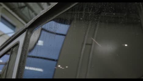 Water-Drops-On-Wet-Window-Of-Jeep-Wrangler-In-The-Garage